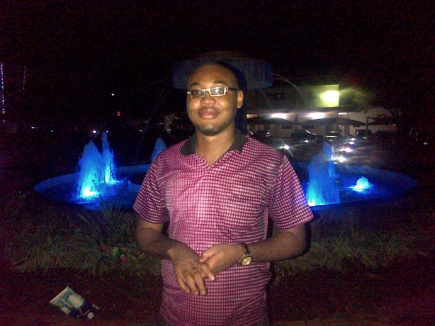 Okoye Charles standing beside the Fountain, VC office, UNN. Photo by Unegbu Chetachi